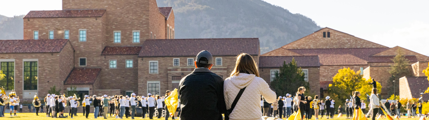 Parents sitting on campus