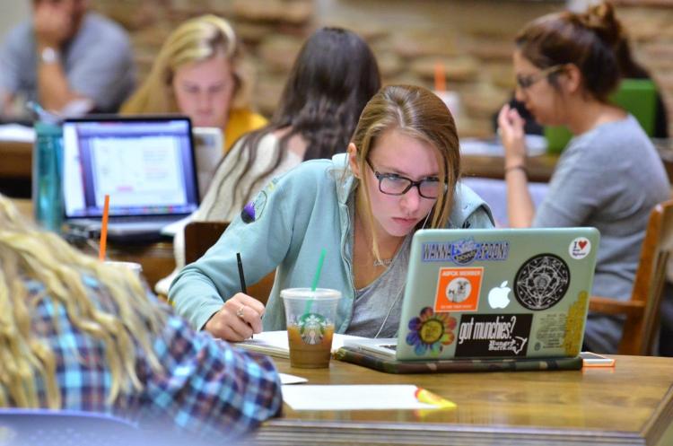 Students studying at tables