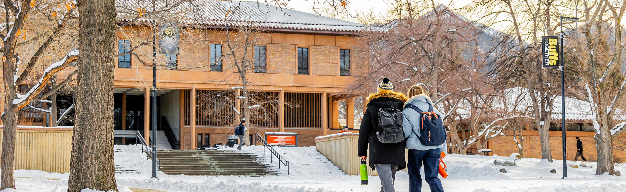 Students walking on a snowy campus