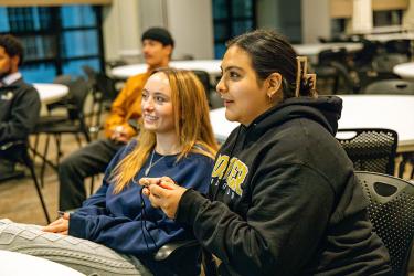 female students sitting at table