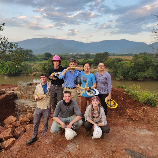 Group photo of travel team members from both universities
