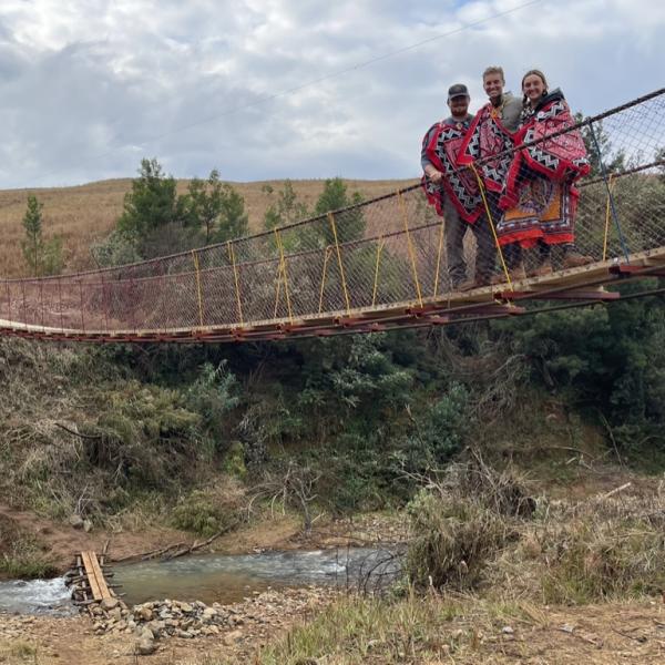 Members standing on Bridge