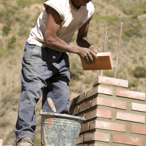 Brick Layer laying bricks