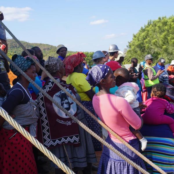 Entire community standing near tower