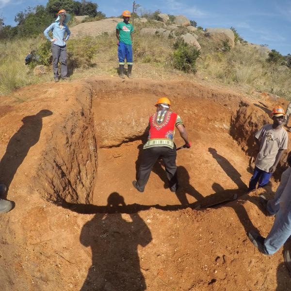 Members digging pit