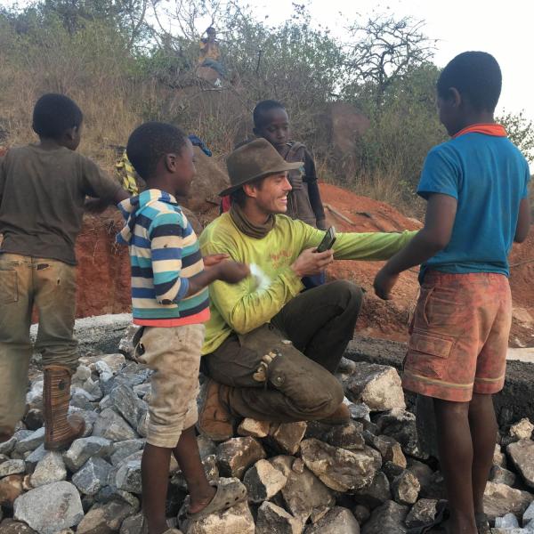 Member with local children