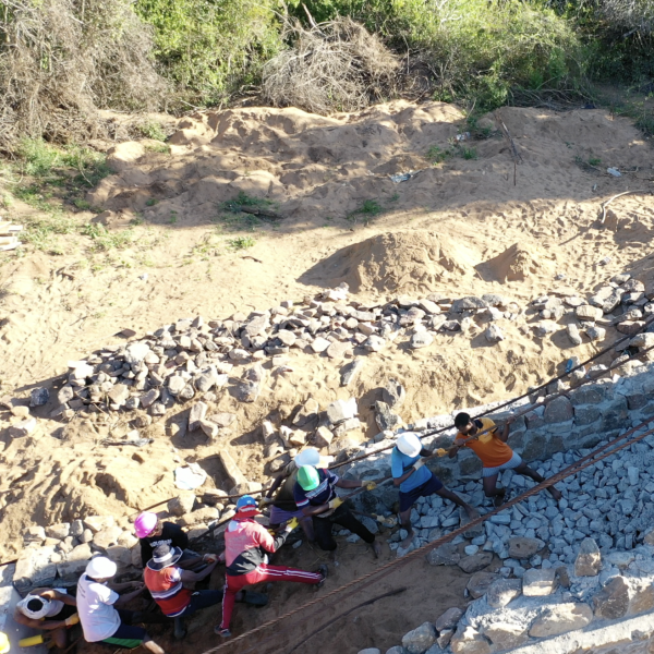 10 people hoisting cable