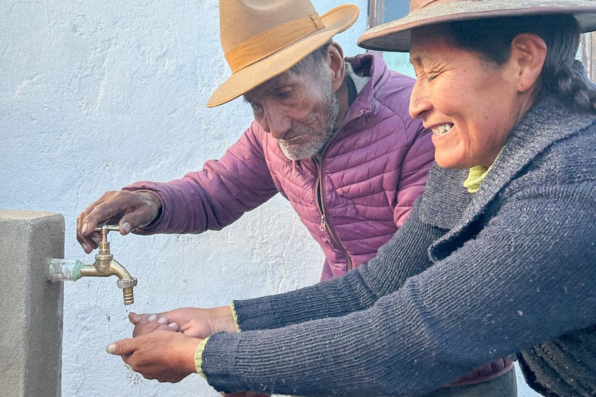 Community members using tap stand