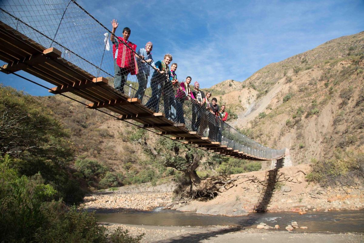 2013 bridge - Members standing on bridge over river