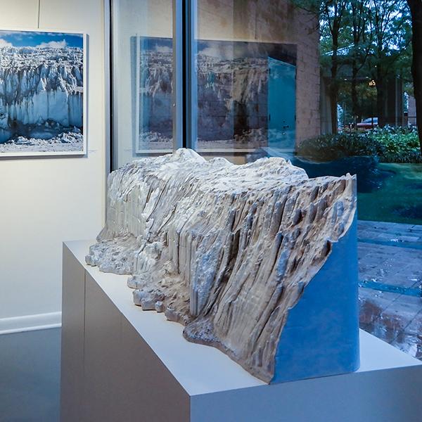 Exhibit by artist Helen Glazer called "Canada Glacier from Lake Fryxell" Picture of photographs of the glacier and a sculpture