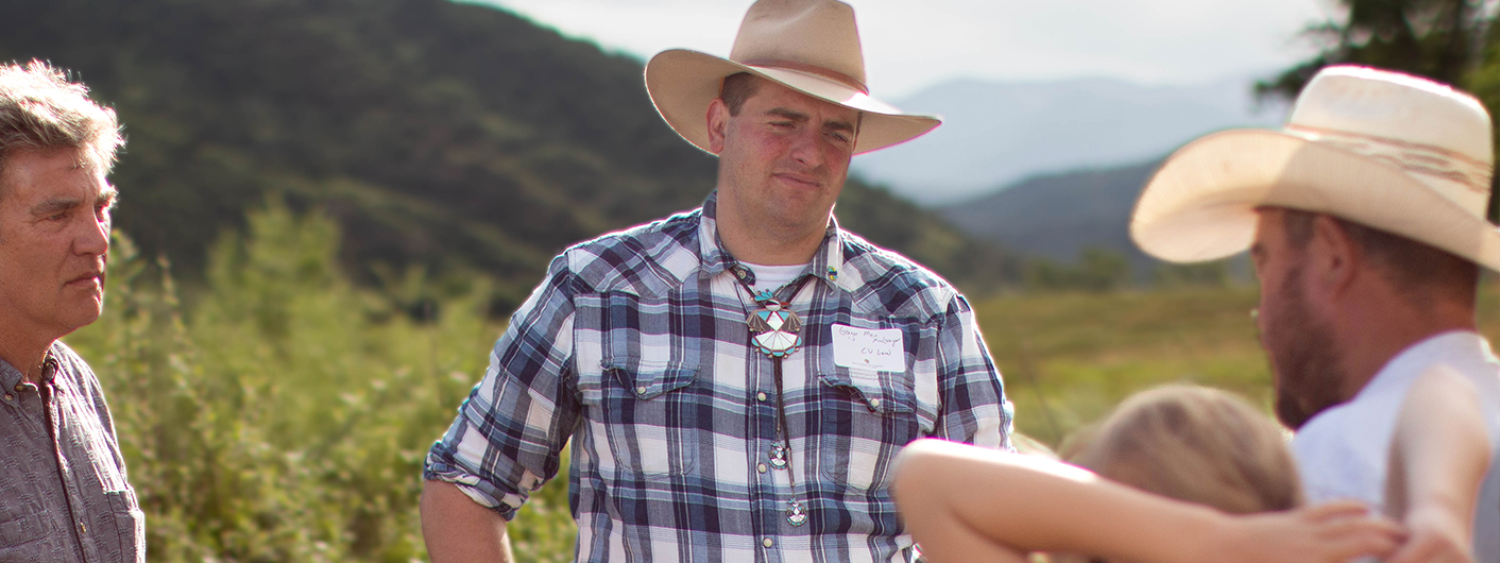 Gregor McGregor speaks with a family member on a ranch in Trinidad, CO