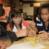 children playing with a classroom science toy