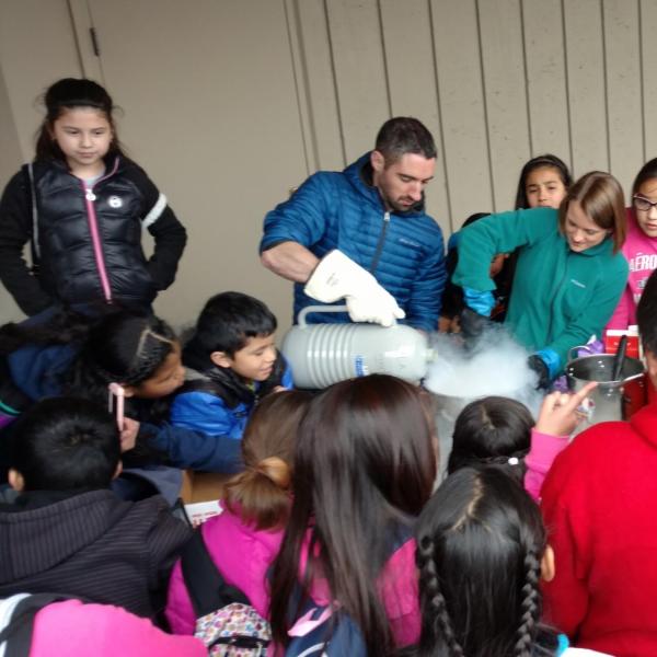A PISEC UE pouring liquid nitrogen into a bowl of ice cream