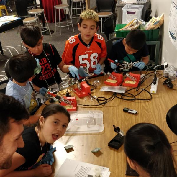 PISEC kids learning how to sodder
