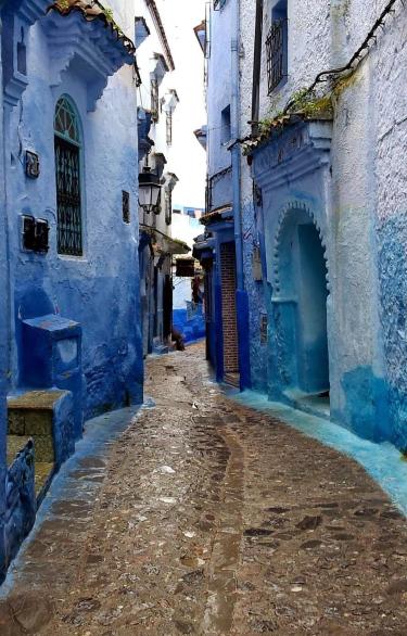 blue buildings alleyway in morocco