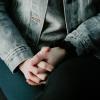 folded hands of a person