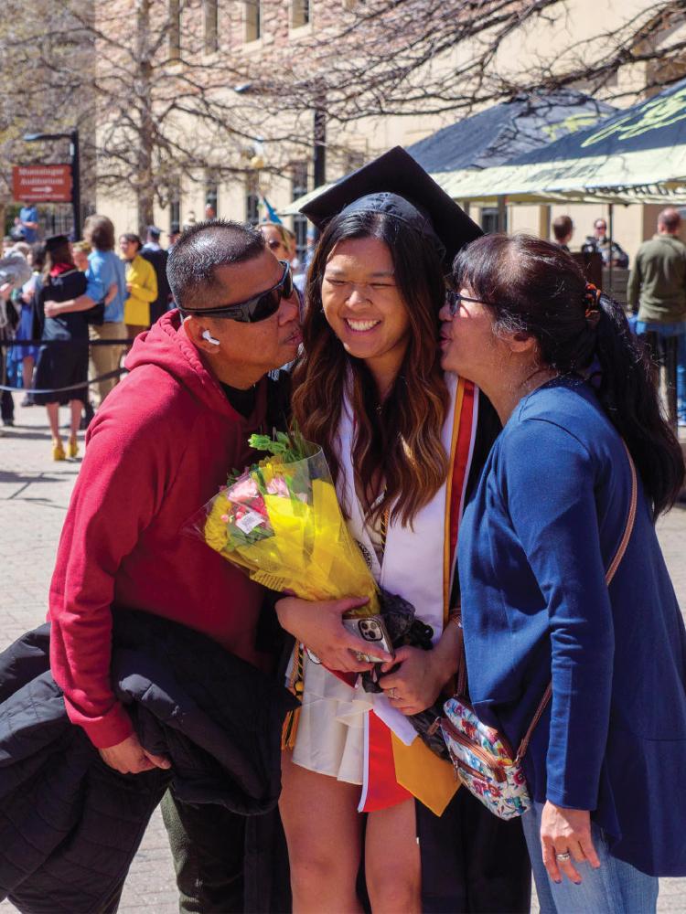 recent CU grad with her parents