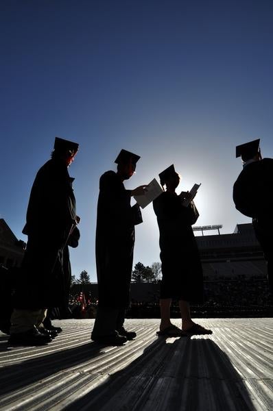 Silhouette of graduates at graduation ceremony