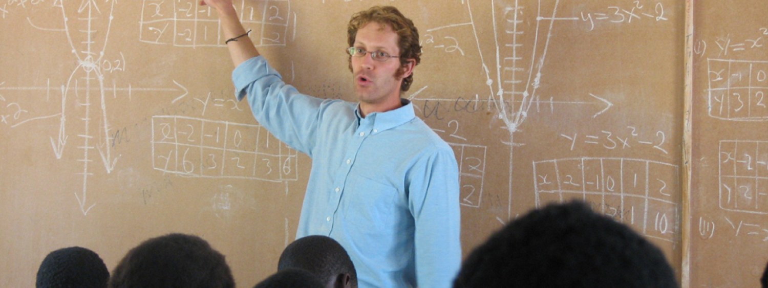 CU Peace Corps - young  man teaching