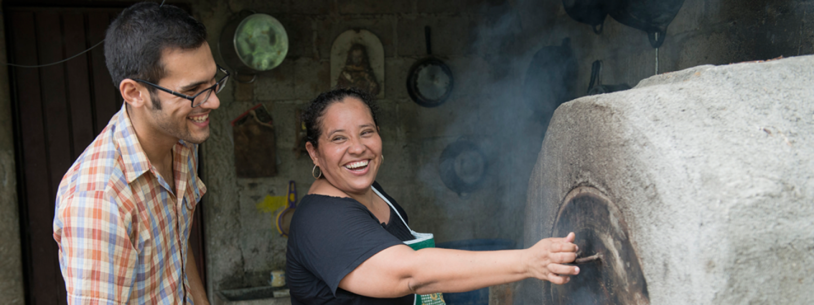 CU Peace Corps - young man helping design oven