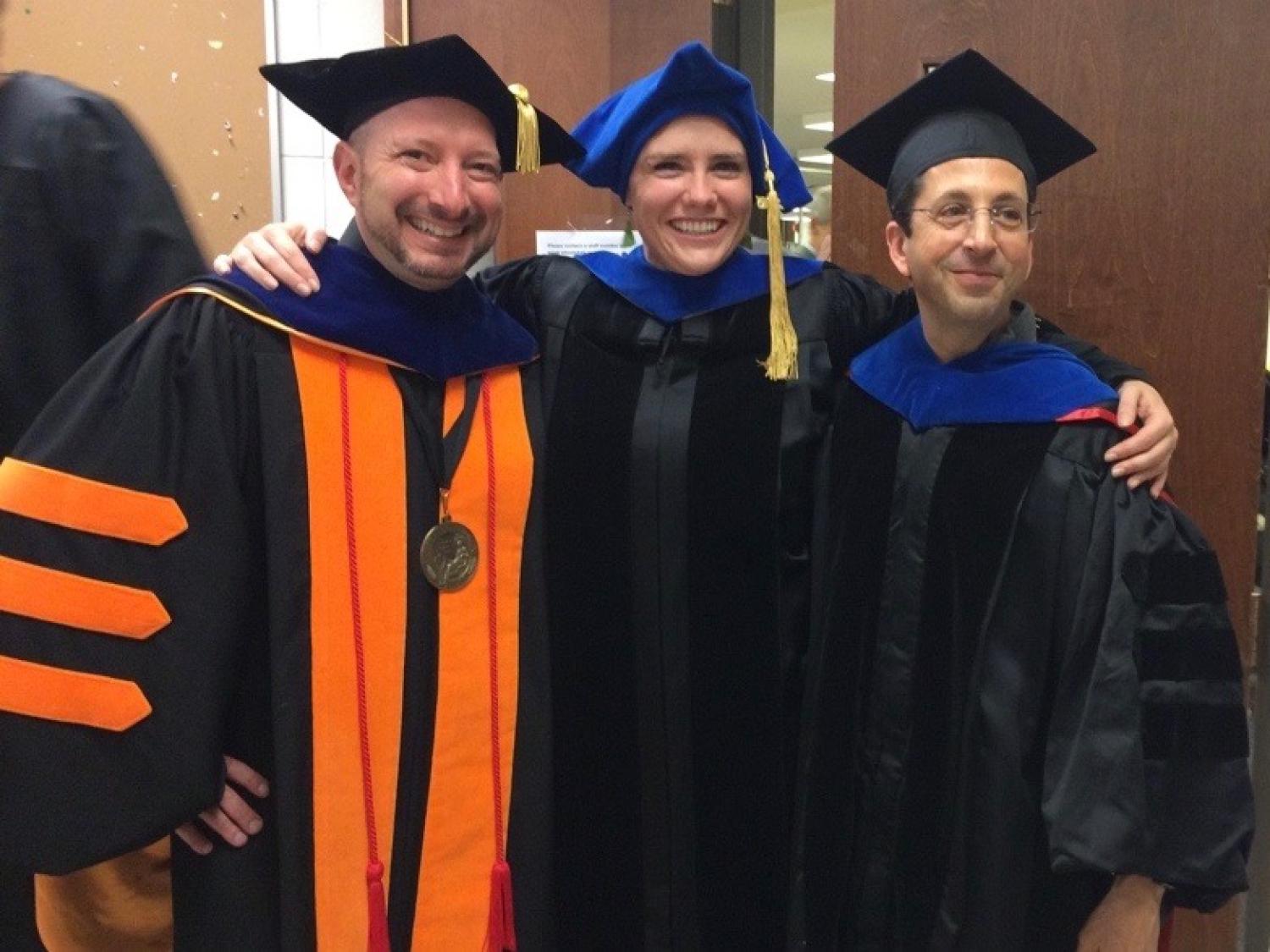 Noah Finkelstein, Bethany Wilcox, Steve Pollock in graduation gowns