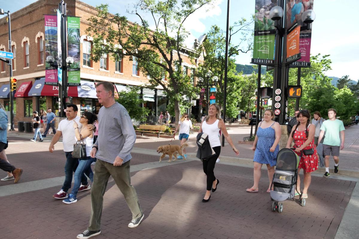 People crossing Broadway on Pearl St Mall