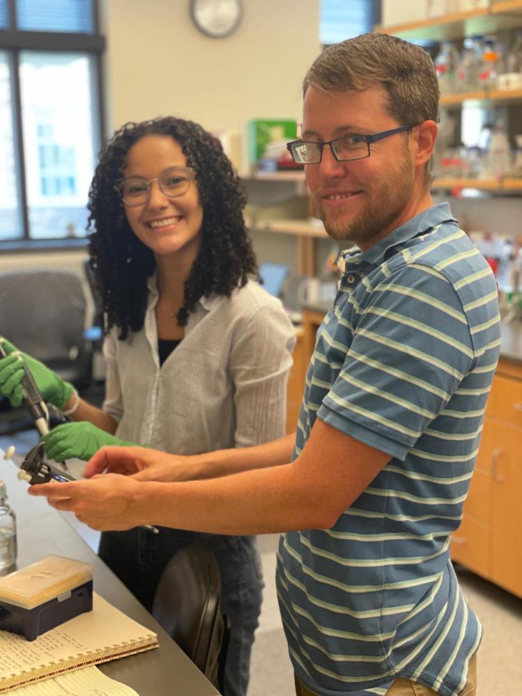 Genesis and Dr. Hough working on an experiment