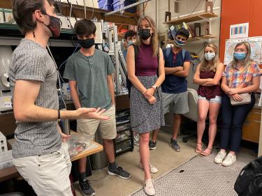 Students discussing in a lab