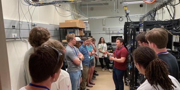 Quantum scholars students visit a lab at NIST