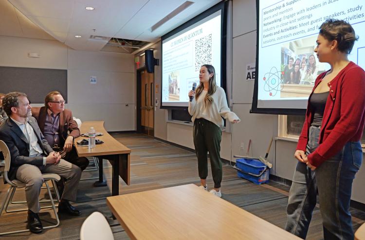 Annalise Cabra and Emily Jerris address the Quantum Scholars