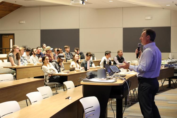 William Clark speaks with students in the Quantum Scholars program