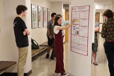 Student presents a poster