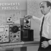 Frank Oppenheimer standing in front of an oscillator