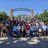 A portrait of the 2024 TASI class standing in front of the flatirons
