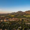 Aerial view of CU Boulder campus with flat irons in background