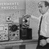 Frank Oppenheimer standing in front of an oscillator