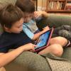 Koji Dennis (left) and Niko Dennis are engrossed in a PhET simulation for iPad. Photo by Kathy Perkins.