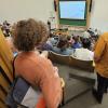 Group of people waiting for a lecture in JILA Auditorium