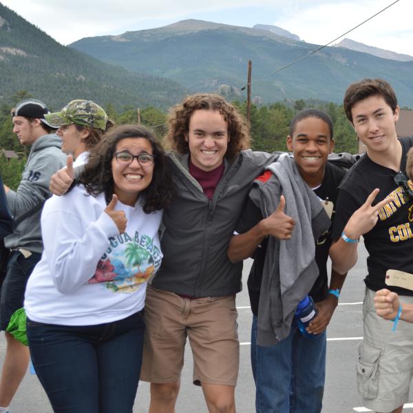 Orientation leaders and staff member, Ryan Dewey, display their enthusiasm for arriving at the Rocky Mountain YMCA in Estes Park