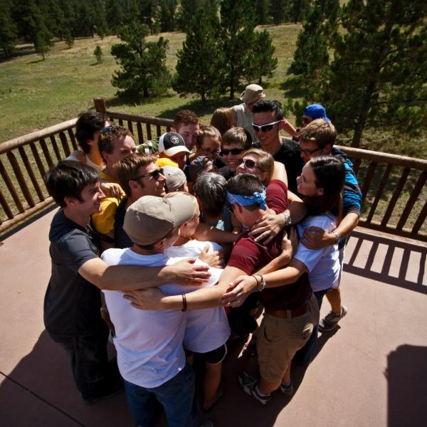 Students give one another a group hug
