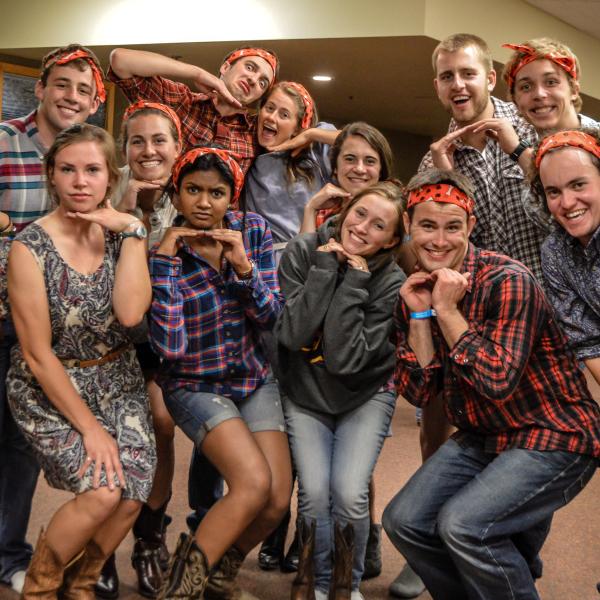 The student staff poses in their square dancing outfits