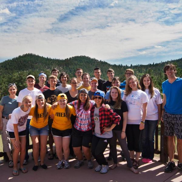 PLC students pose for a group picture on the deck at Highlands Camp