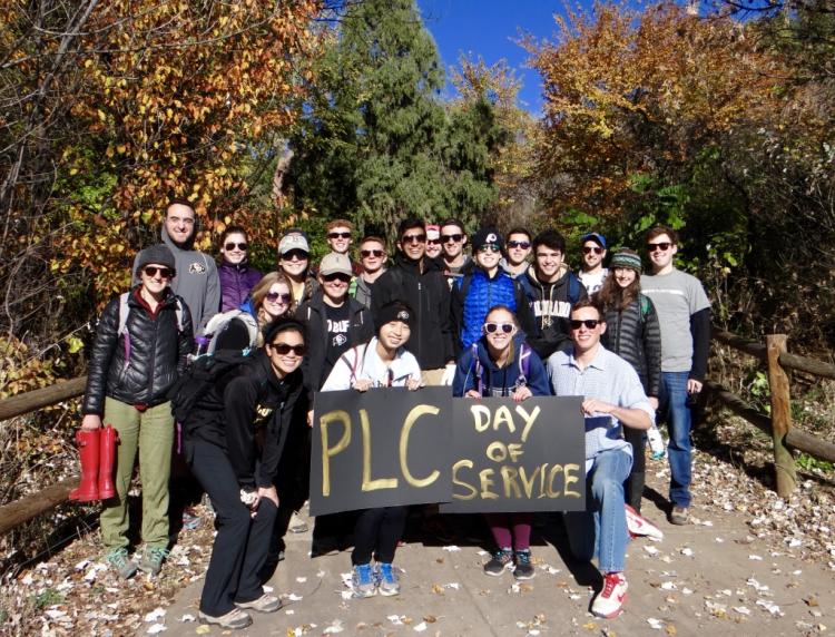 Students posing for a photo during a day of service activity. 