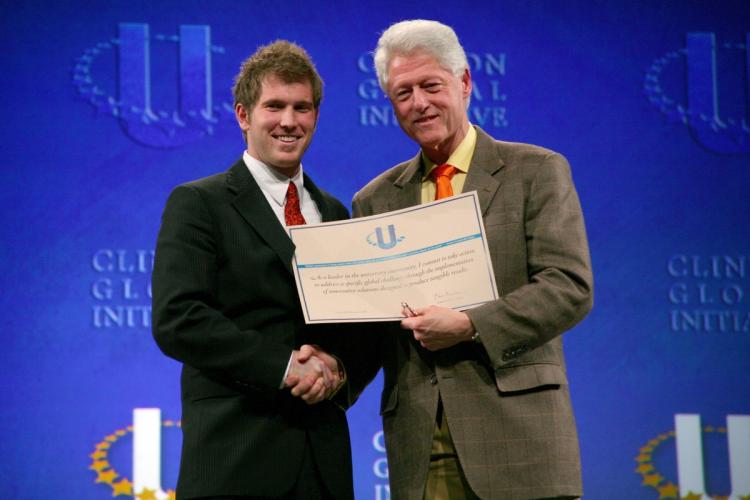 Mark Arnoldy, PLC 2005, poses with President Bill Clinton during the Clinton Global Initiative University Conference in 2009