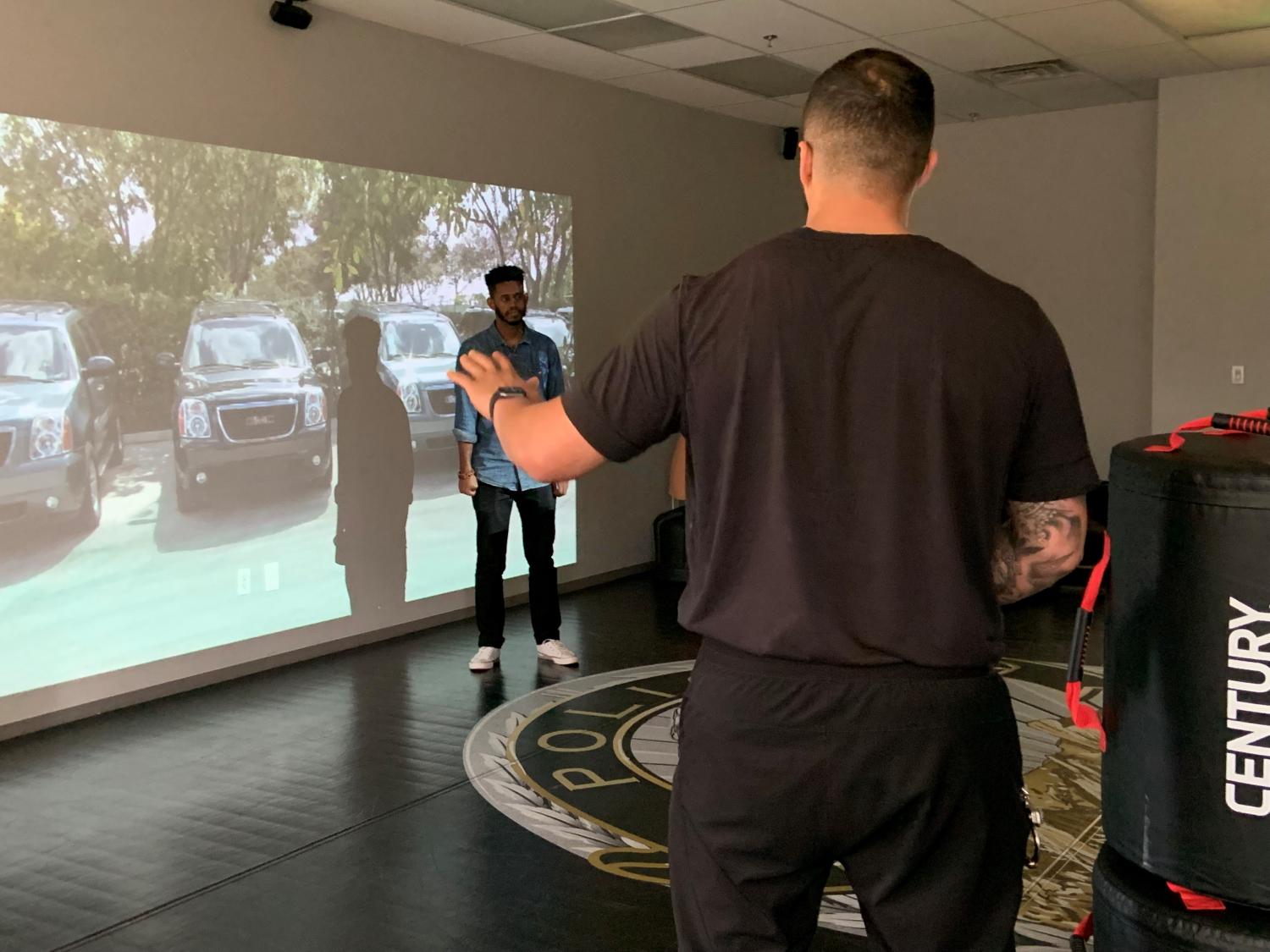 CUPD officer in scenario-based communication training