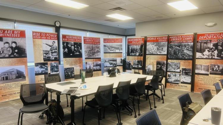 Poster display is shown at a What You Do Matters: Lessons from the Holocaust training; Oct. 2023
