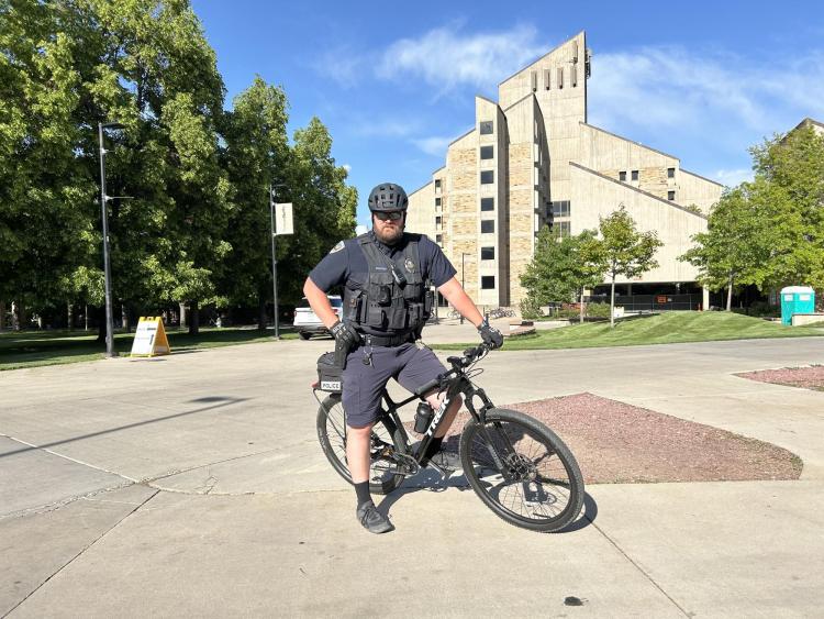 CUPD officer conducting patrol on a bicycle