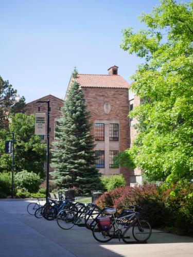 A full bike rack on the campus of CU Boulder