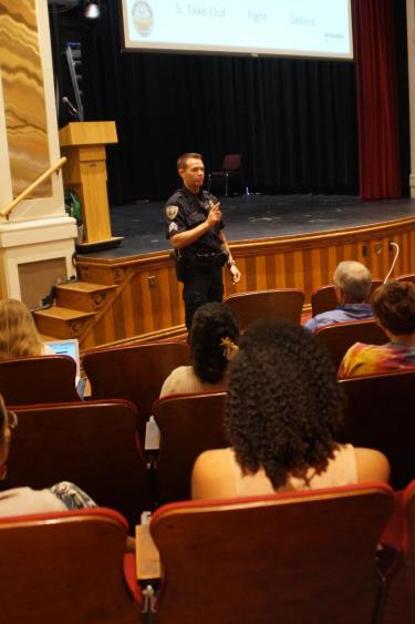 A CUPD officer teaches an active harmer response class to CU Boulder affiliates