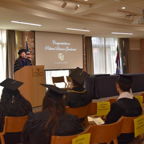 Associate Chair giving graduation speech